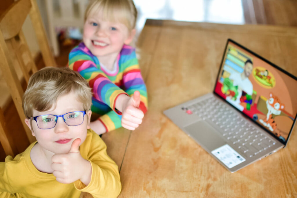 Twins giving thumbs up to Tiger and Tim educational show for kids