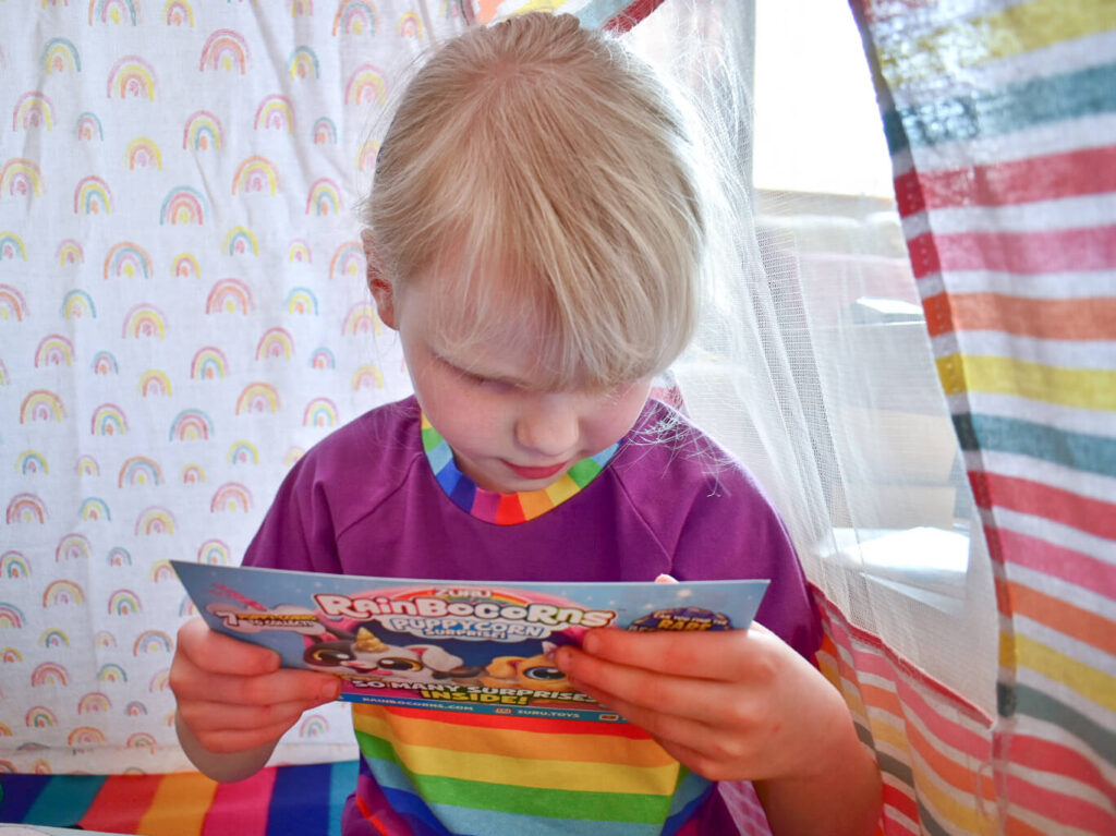 Girl looking at Puppycorns leaflet