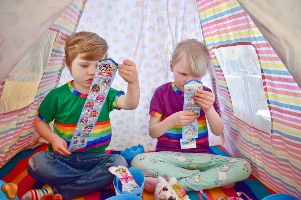 Twins looking at ZURU Rainbocorns Puppycorns SurpriseCollector's Guide