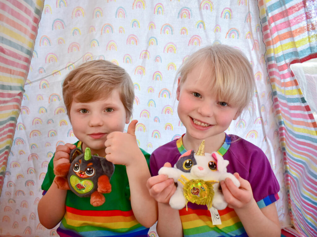 Twins holding ZURU Puppycorns