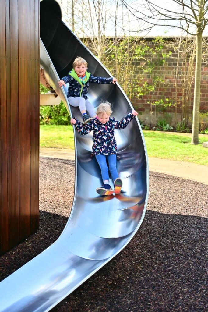 Twins on slide in Magic Garden