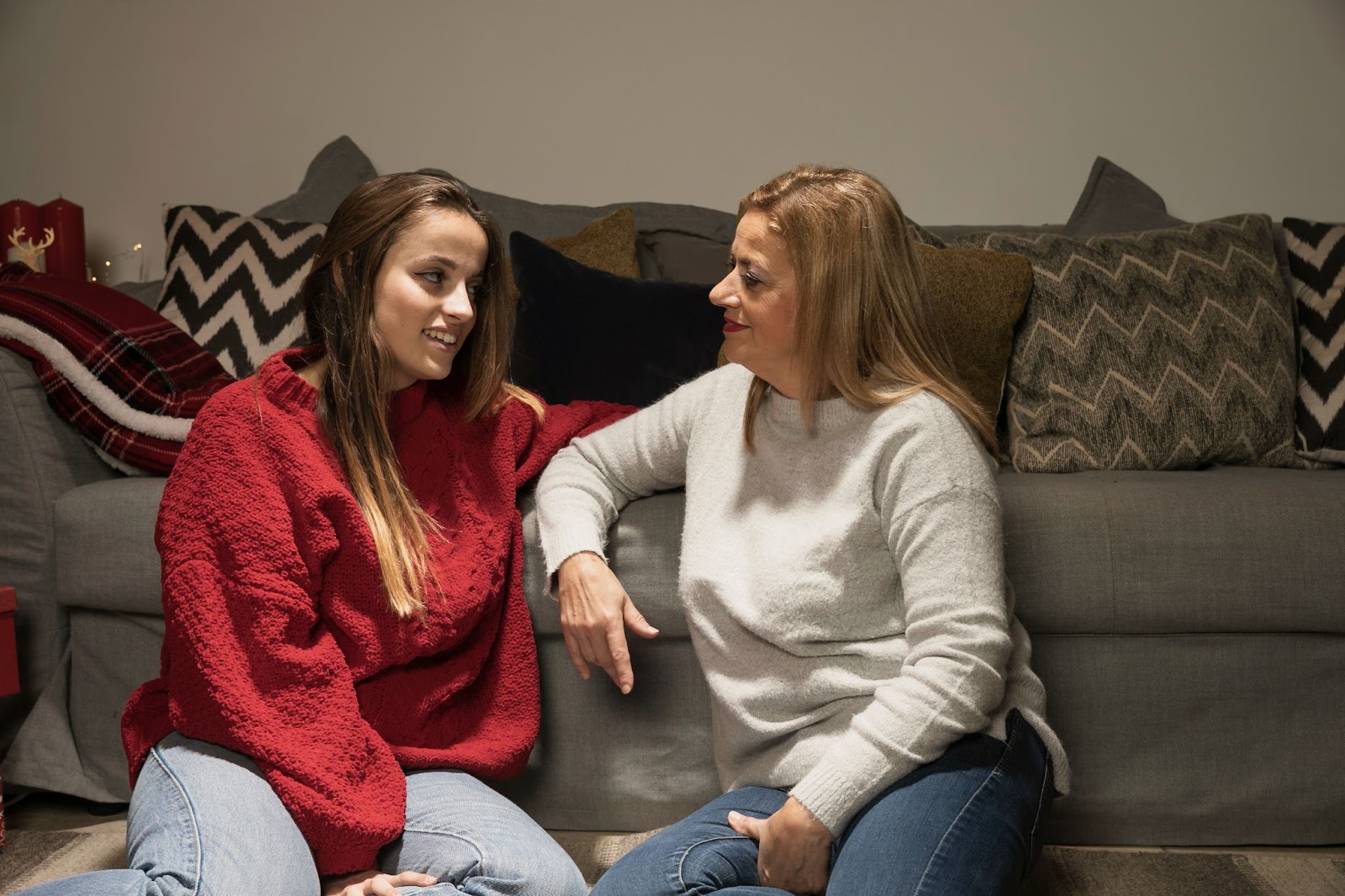 mother and teen daughter looking at each other and chatting