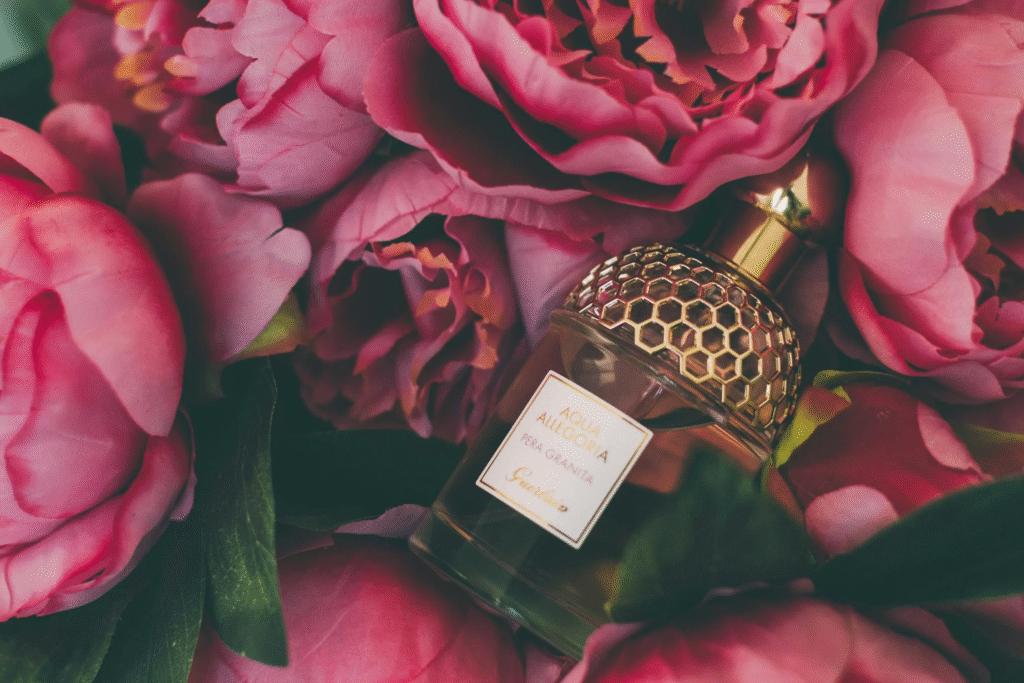 perfume bottle with pink flowers