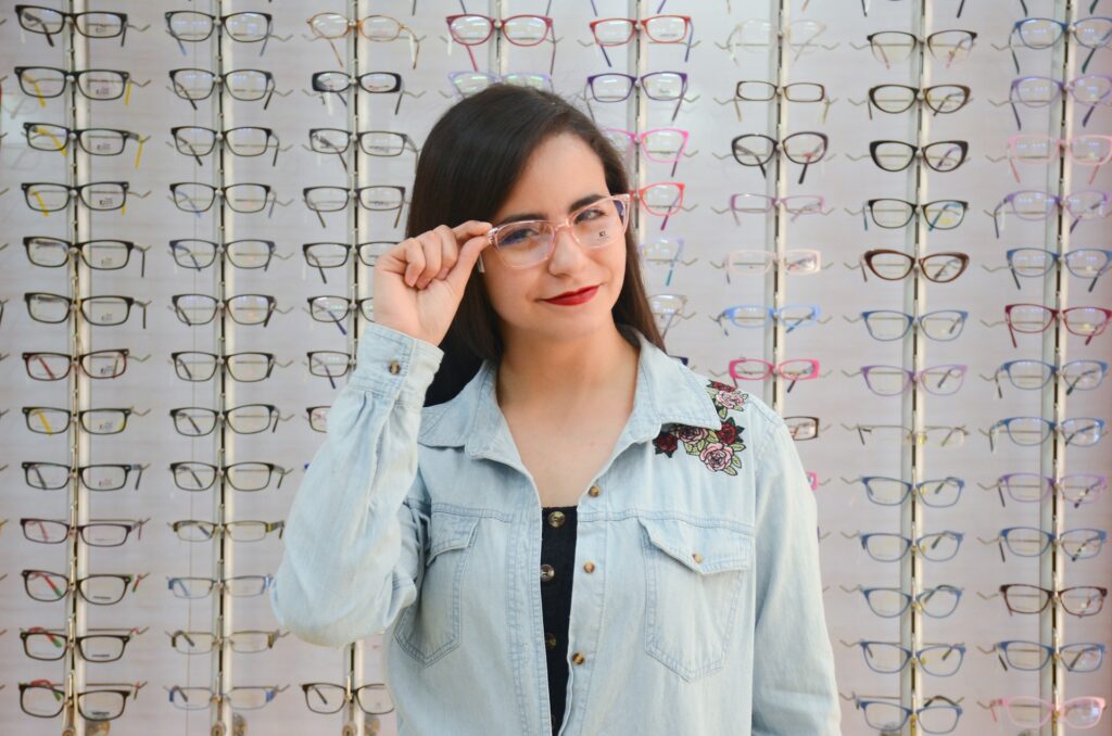 woman trying on new pair of glasses 