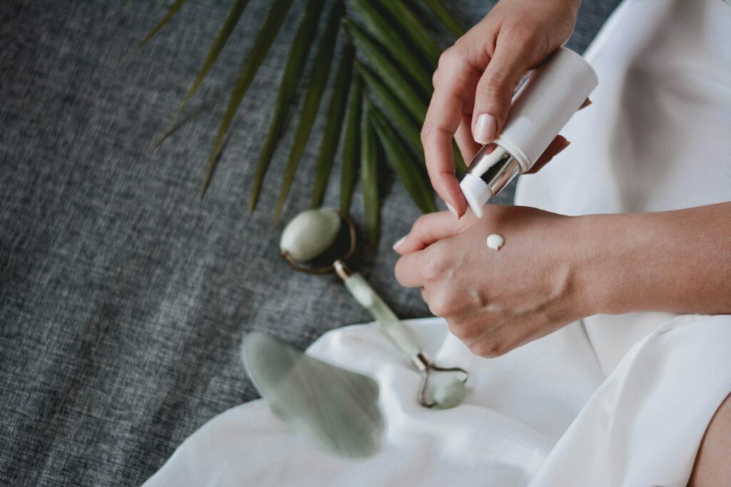 woman's hands and skincare cream