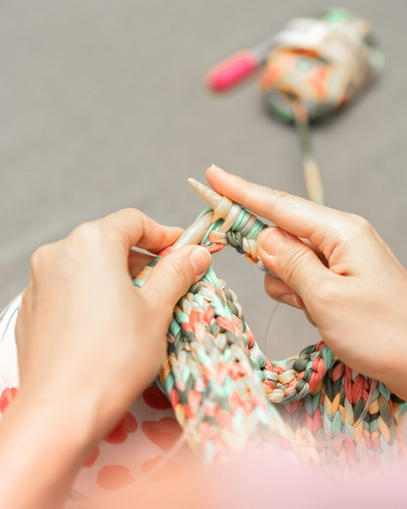 close-up of hands knitting